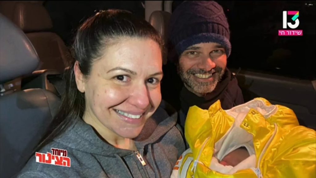 A baby just a few days old united with his Israeli parents, after the surrogate mother gave birth in war-torn Kiev.